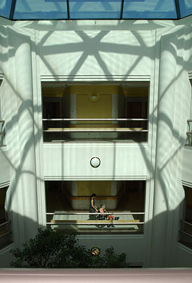 View of the atrium in the Friedman Pavilion with skylights above and staff and resident below